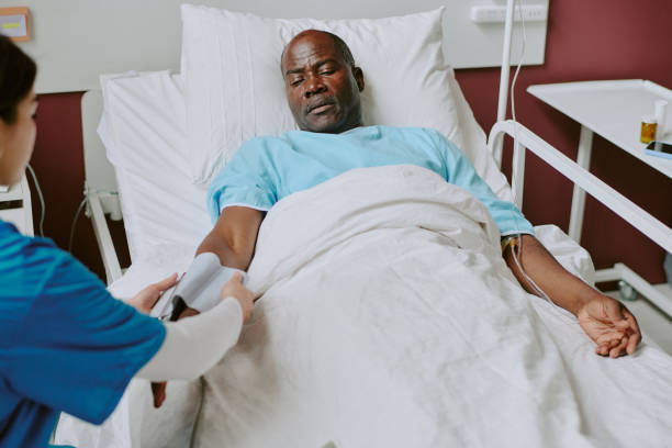 istock Assisting Elderly Patient During Medical Examination 2187457533