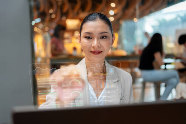 istock A determined businesswoman evaluates investment opportunities using advanced graphical data visualizations on a laptop. Demonstrating expertise in finance, innovation, and data analysis within a relaxed coffee shop setting. 2187458155