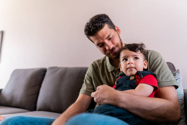 istock Father with baby son at home 2187462846