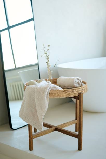 istock Cotton Towels on Wooden Table in Bathroom 2187463329