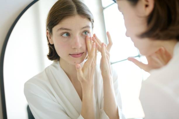 istock Young Woman Massaging Eyes Bags 2187463542