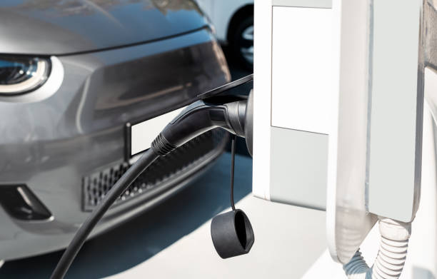 istock Electric car charging station background. EV charge port. 2187465303