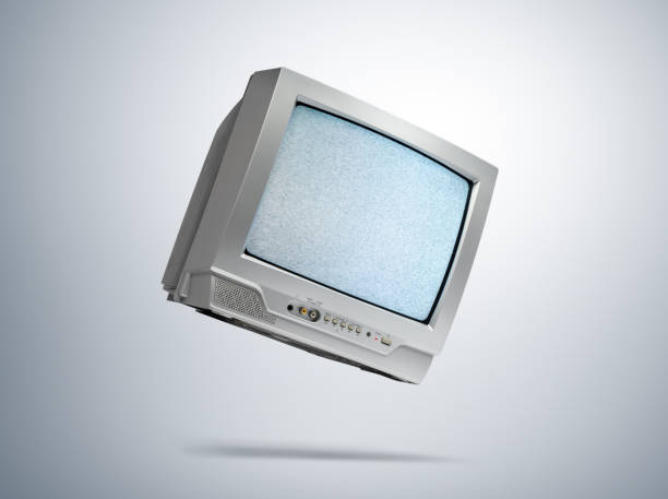 istock Working old CRT TV in the fall, noise and interference on the screen, on light gray background. File contains a path to isolation. 2187465541