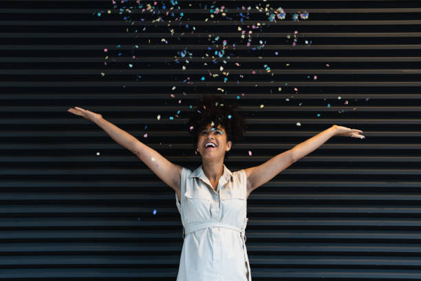 istock Happy black pregnant woman throwing confetti 2187468034