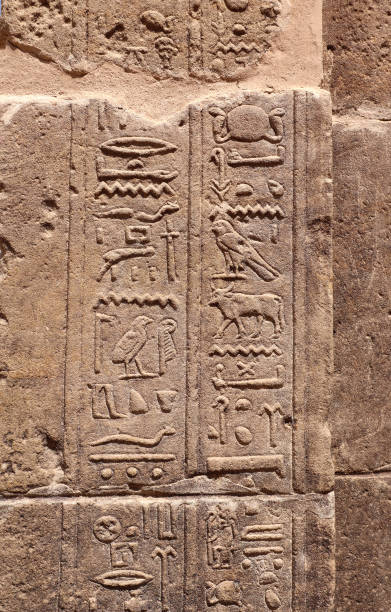 istock Ancient Egyptian hieroglyphs on stone wall, Karnak Temple Complex, Luxor, Egypt, Africa. Stone carvings with hieroglyphs at Karnak temple, Luxor, Thebes 2187469725