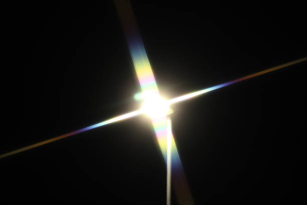 A lone bright street light guiding people on their way through the dark