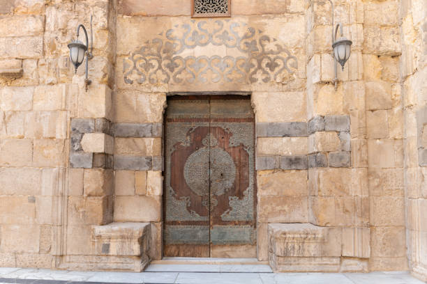Al-Hakim Mosque minaret with stone fortification in Old Cairo.