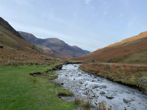istock Looking down Honister Pass by a stream, Lake District, England 2187470504