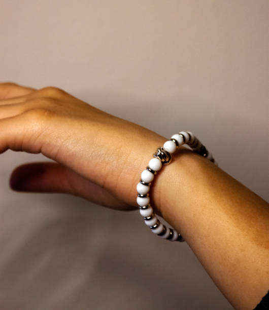 istock Beaded Bracelet with Metallic Charm 2187470677