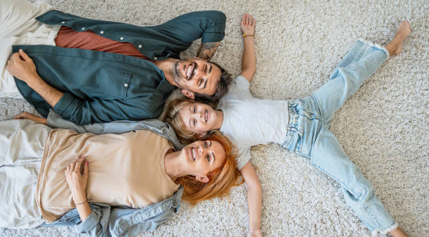istock Happy parents and little daughter at home 2187471249