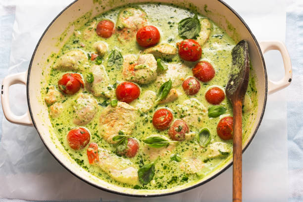 istock Chicken in creamy basil sauce with cocktail tomatoes 2187471902