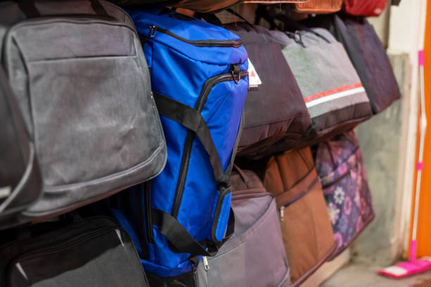 istock Bags hanging on the wall display in the store 2187471915