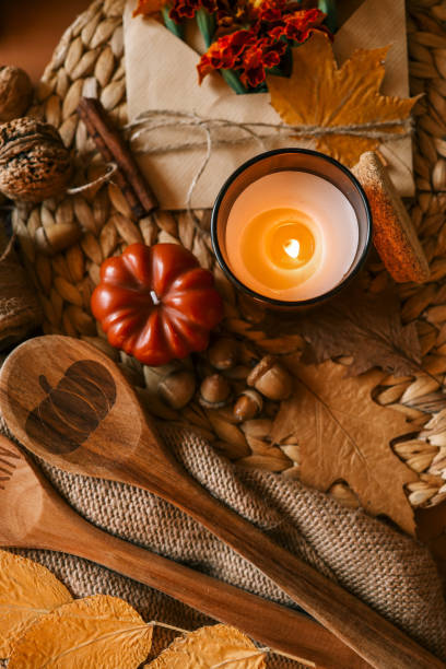 istock Burning candle in a cozy warm homey autumn atmosphere 2187472461