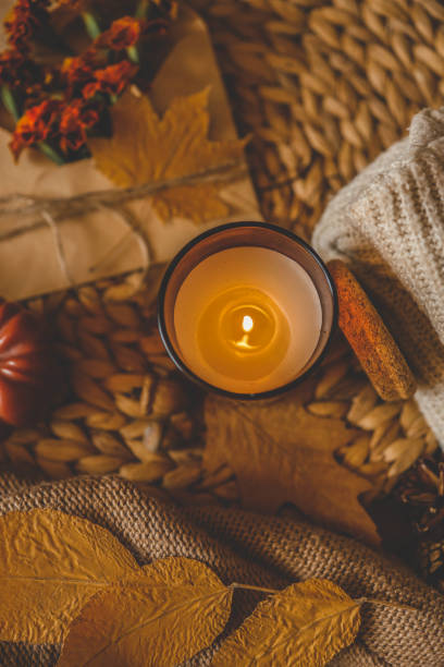istock Burning candle in a cozy warm homey autumn atmosphere 2187472533
