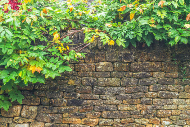 Brick wall texture, background. Orange brick wall background for exterior design. Construction concept, outdoor buildings, garage or house. Wall with classic checkerboard pattern and visible joints