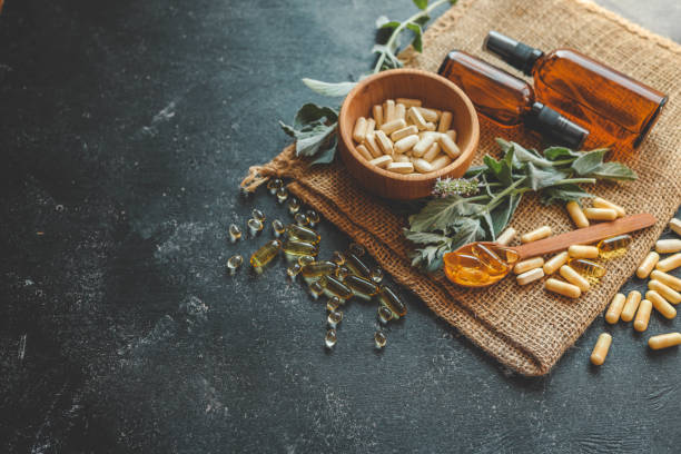 istock Natural vitamins organic on dark background 2187473425