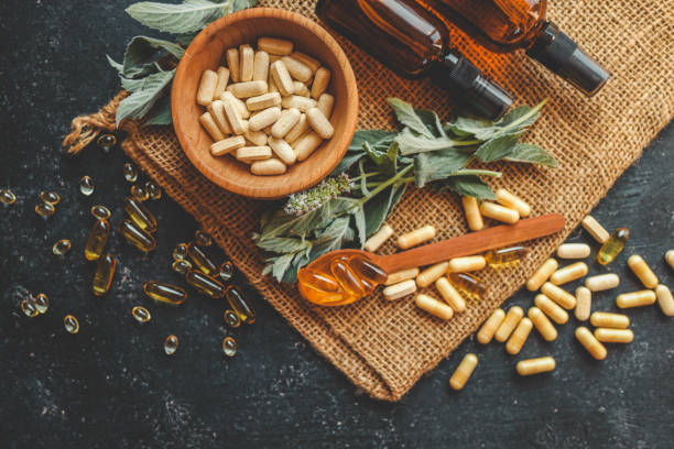 istock Natural vitamins organic on dark background 2187473431