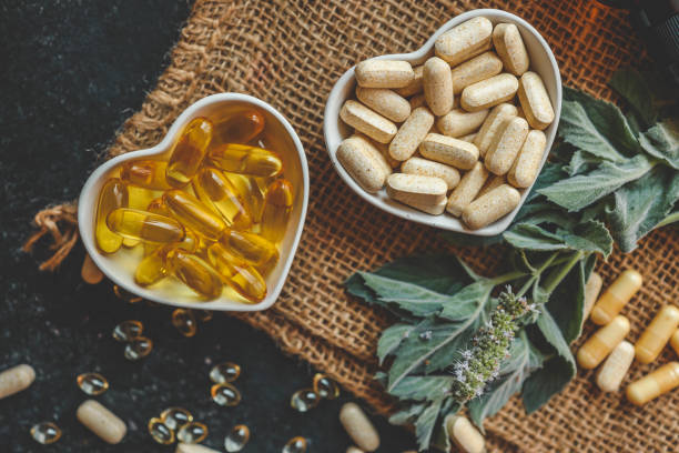 istock Natural vitamins organic on dark background 2187473432