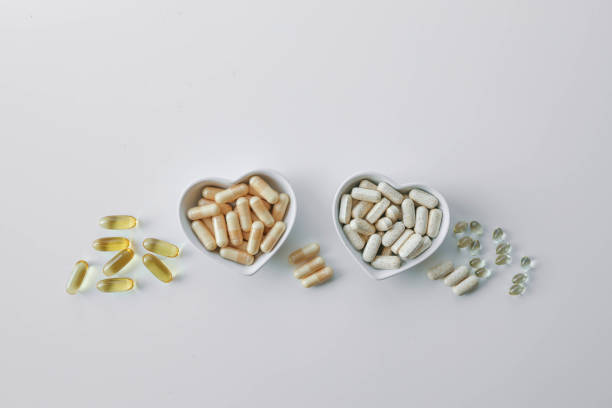 istock Tablets and vitamins on white background, banner advertising, pharmaceuticals 2187473571