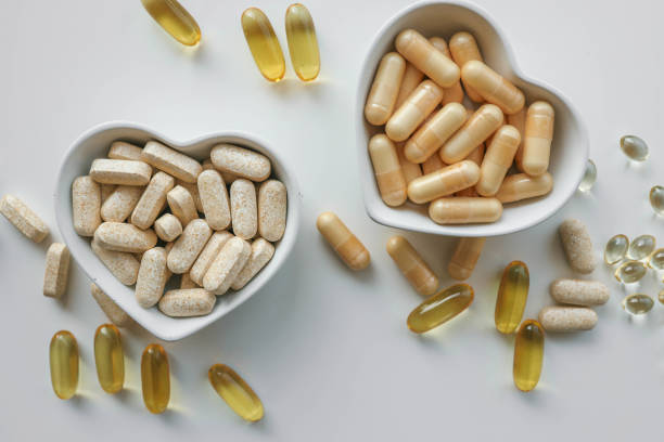 istock Tablets and vitamins on white background, banner advertising, pharmaceuticals 2187473572