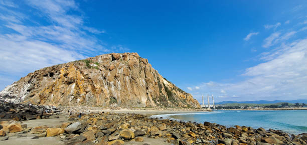 istock Morro rock mountain peak back side view on Morro Bay Beach in California 2187476451