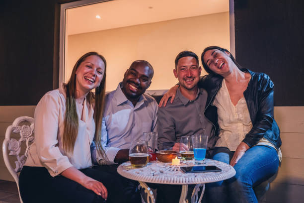 istock Group of Friends Enjoying a Relaxed Evening Together 2187476536