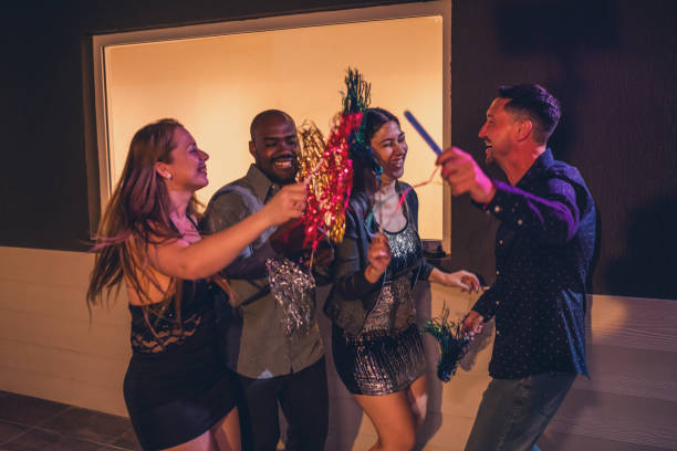 istock Joyful Group Celebrating New Year's Eve With Excitement 2187476655
