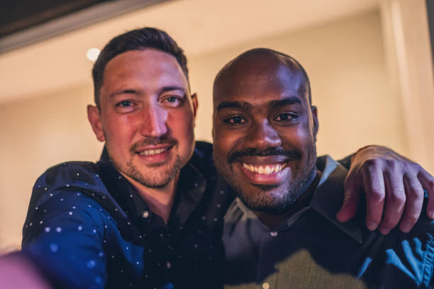 istock Two Friends Smiling Cheerfully in a Close-Up Portrait 2187476942
