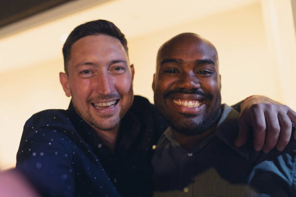 istock Two Friends Smiling and Embracing for a Happy Snapshot 2187476979