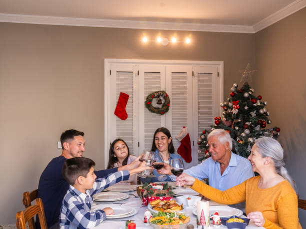 istock Family Enjoying a Festive Christmas Dinner Celebration Together 2187478373