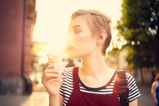short haired woman ice cream enjoyment walk lifestyle. High quality photo