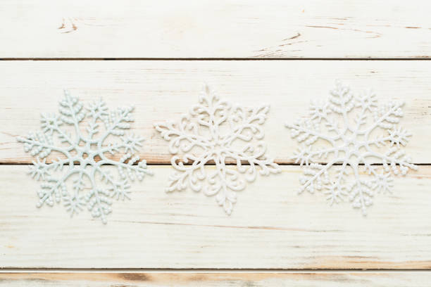 Gold and red colored ornate Christmas ribbon on the red background with copy space
