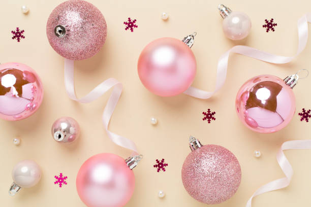 istock Pink christmas balls with decor on color background, top view 2187482711