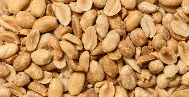 istock Heap of roasted peeled peanuts, macro 2187482983