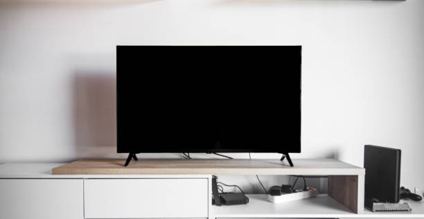 istock A black flat screen television sits on a wooden shelf 2187488668