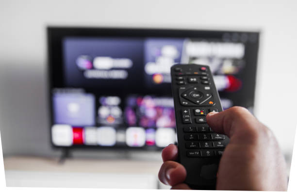 istock A person is holding a remote control in front of a television 2187488707