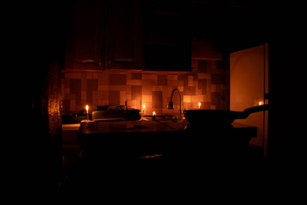 Poor and unrenovated apartment without electricity with candles in the kitchen, rocket attacks led to power outages in Ukraine