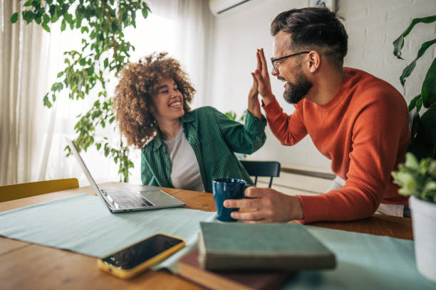 istock Business people celebrating success in an office 2187489323