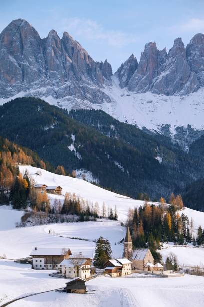 istock Snowy village in the Dolomites with mountain backdrop. 2187489487