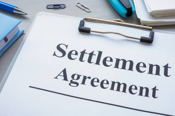 istock Close up of clipboard with settlement agreement. 2187490683