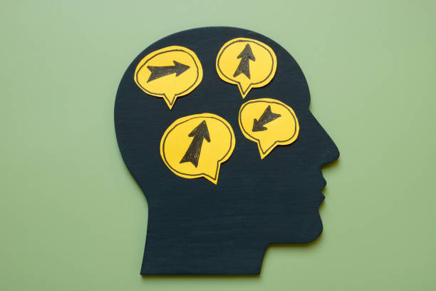 Head with arrows pointing in different directions. Decision-making and conflicting thoughts concept.