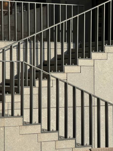 istock Modern outdoor staircase with metal railings and stone steps 2187492045