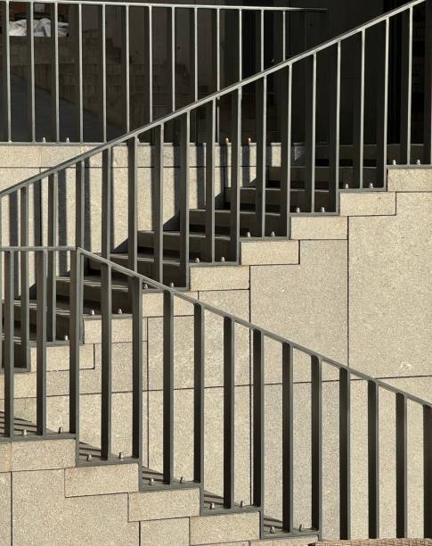 istock Modern outdoor staircase with metal railings and stone steps 2187492046