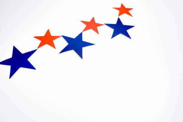 Red blue stars decor on light background. Copy space, minimalist style, festive background for desig