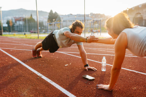 istock Dynamic Duo. Stretching and Prepping for an Active Day on the Track 2187492882