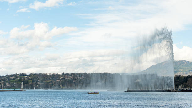 The Jet d'Eau in Geneva on a cloudy afternoon