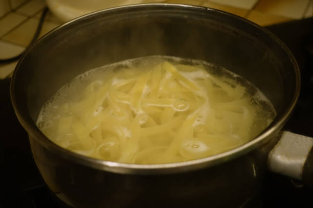istock Tagliatelle pasta being cooked in a pan filled with hot water 2187496503