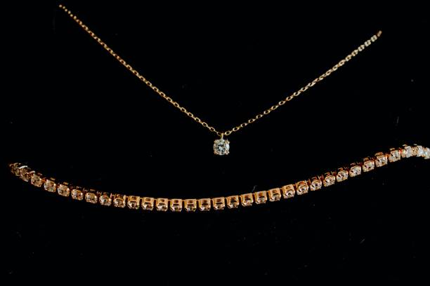 istock Gold Necklace and Bracelet with Diamonds 2187497080