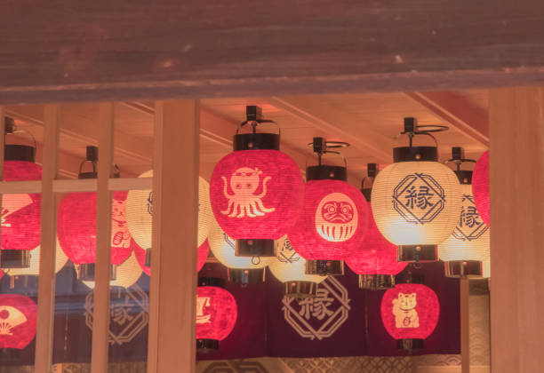 Japanese lanterns are traditional lighting devices made from materials like paper, silk, or metal, often framed with bamboo or wood. They are used for both indoor and outdoor decoration, creating a warm, ambient glow in various settings. Taken in Japan, Kanazawa, 12.04.2024