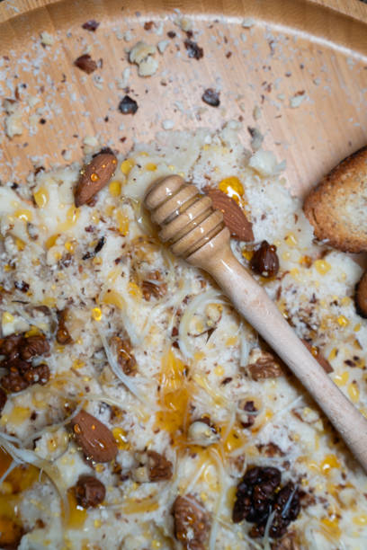 Indulge in the ultimate combination of organic flavors with this beautifully arranged Butter Board. Featuring homemade, creamy butter as the base, topped with a selection of organic, roasted almonds, hazelnuts, walnuts, and tangy cheese, all drizzled with natural honey and paired with vibrant orange crisps. Finely grated nuts are sprinkled on top for added crunch, while a wooden honey spoon adds a touch of rustic elegance. A wholesome, mouthwatering spread that’s perfect for any occasion — all ingredients are organic, made with care for both taste and health.